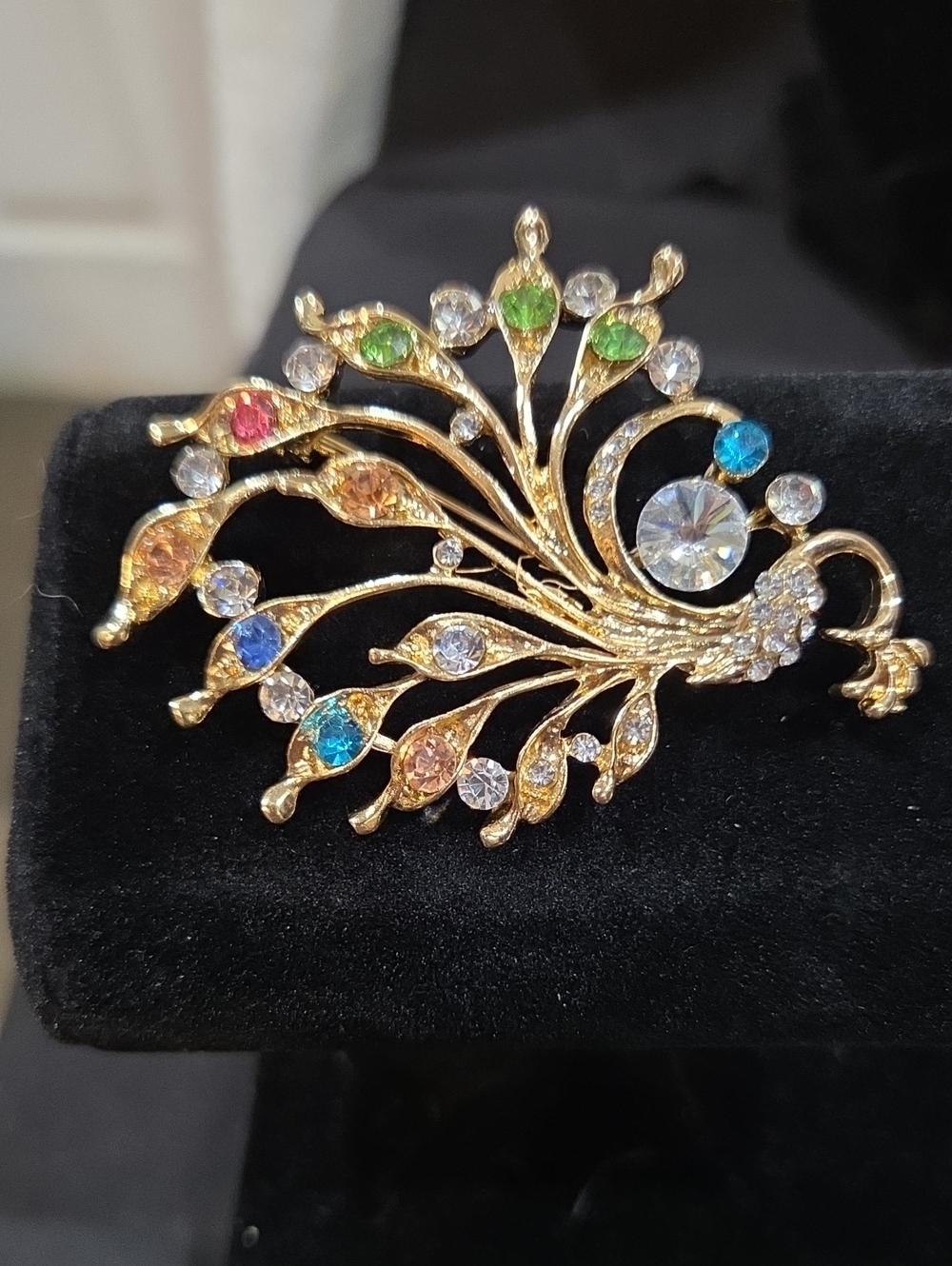 GOLDTONE AND GEMSTONE PEACOCK BROOCH